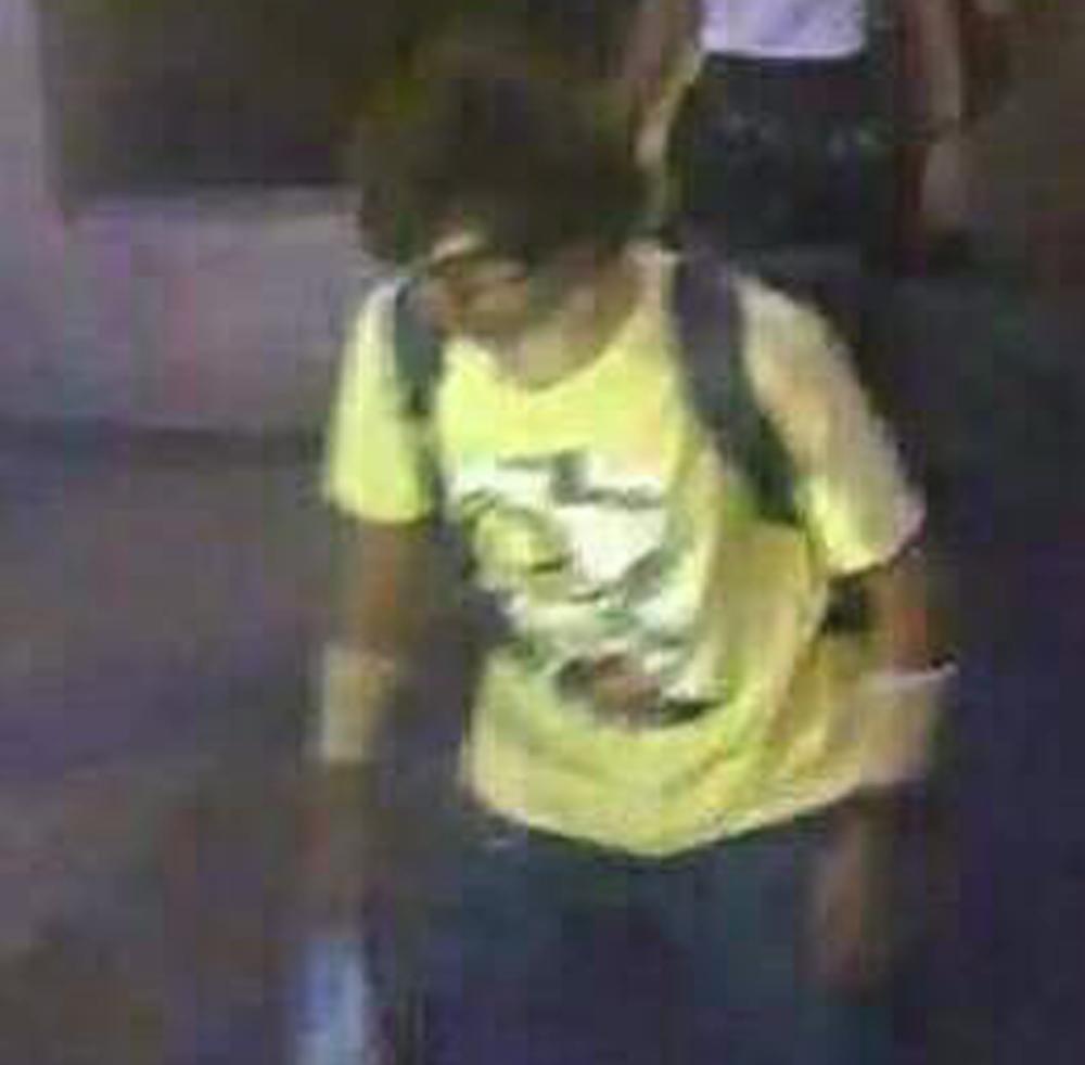 This image released by the Royal Thai Police shows a man near the Erawan Shrine before an explosion occurred in Bangkok