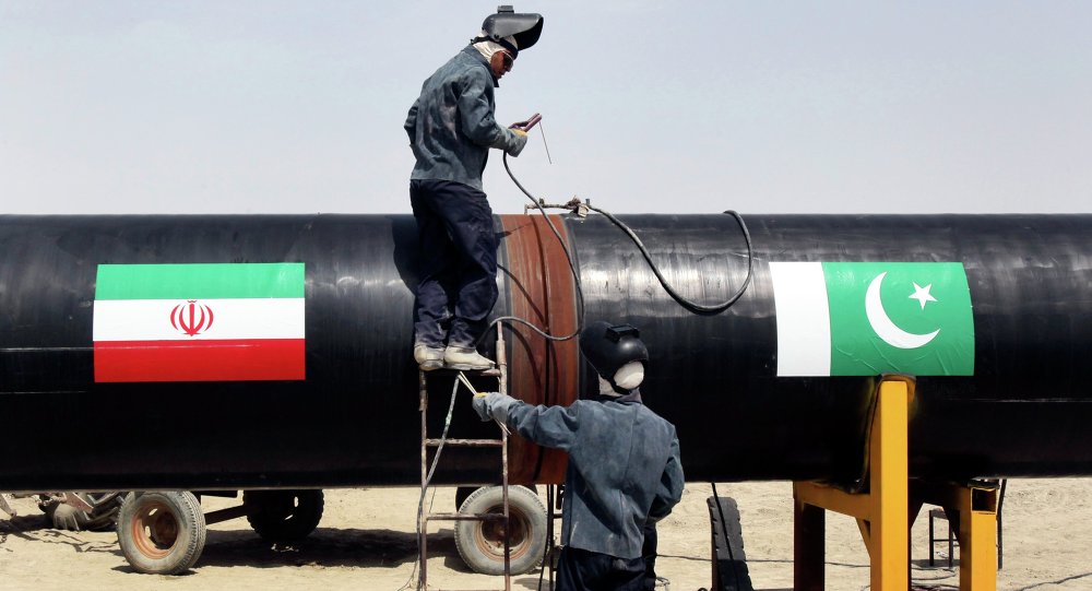 Iranian workers weld two gas pipes together at the start of construction on a pipeline to transfer natural gas from Iran to Pakistan in Chabahar southeastern Iran near the Pakistani border. File