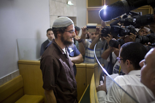 Head of a Jewish extremist group Meir Ettinger appears in court in Nazareth Illit Israel Tuesday Aug. 4 2015. Israel said Tuesday it was interrogating the suspected head of a Jewish extremist group in the first arrest of an Israeli suspect following