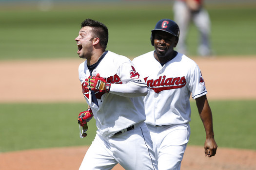 Nick Swisher #33 of the Cleveland Indians celebrates with Michael Bourn #24 after hitting a walk off grand slam in the tenth inning of the game against the Los Angeles Angels of Anaheim at Progressive Field