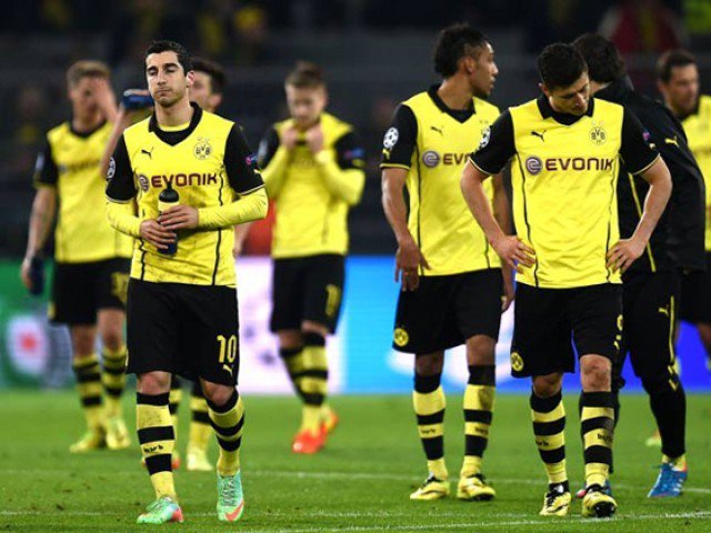 Dortmund's players react after the UEFA Champions League quarter-final second leg football match Borussia Dortmund vs Real Madrid CF in Dortmund