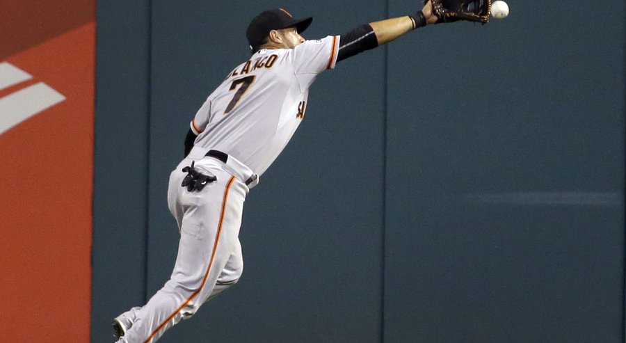 San Francisco Giants center fielder Gregor Blanco can't reach a ball hit for a triple by St. Louis Cardinals&#39 Stephen Piscotty during the eighth inning of a baseball game Monday Aug. 17 2015 in St. Louis