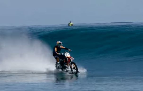 Just a daring stunt rider surfing on a motorbike