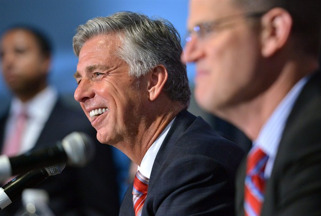 Dave Dombrowski center the Boston Red Sox new president of baseball operations speaks to reporters after being introduced at a baseball news conference