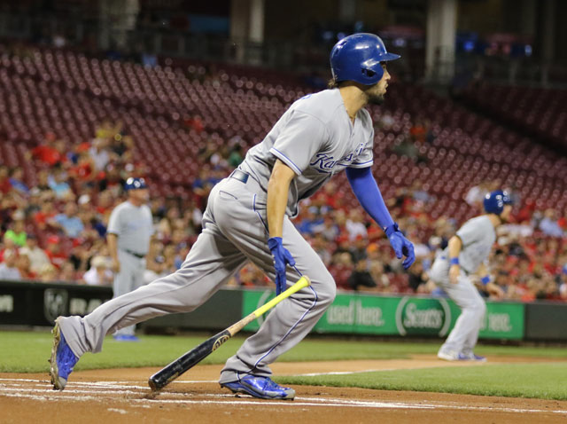 Kansas City Royals first baseman Eric Hosmer knocks a single to score Ben Zobrist, rear during the first inning of a baseball game Wednesday