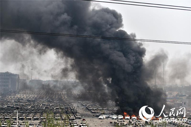 Firefighter rescued from blast zone in China's Tianjin port