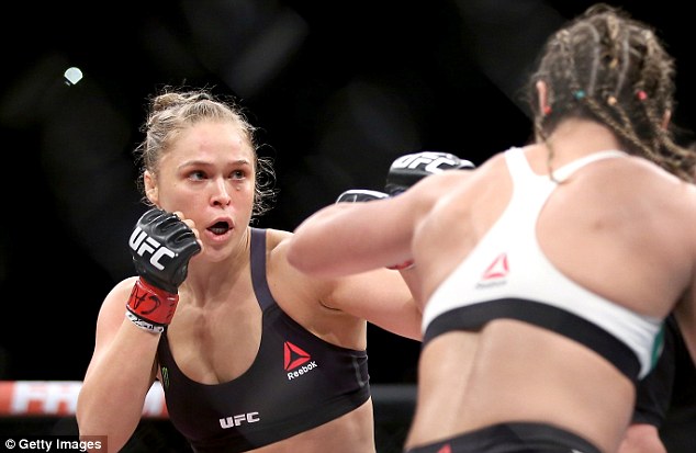 UFC champ Rousey wins again in less than a minute