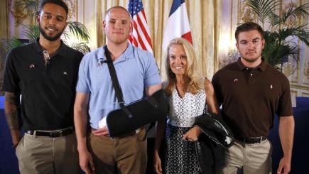 Anthony Sadler Spencer Stone Jane D Hartley US Ambassador to France and Alek Skarlatos pose for