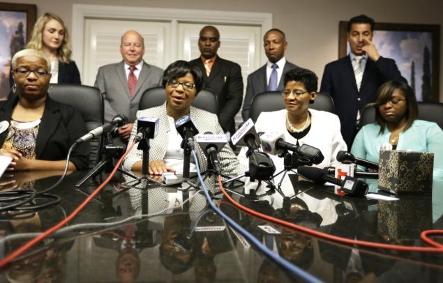 Sandra Bland's family holds a news conference Tuesday in Houston. They announced they filed a wrongful death lawsuit against the Trooper Brian Encinia and other officials saying it was a last resort after being unable to get enough information about