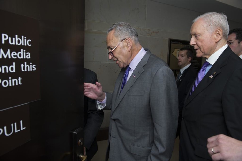 Sens. Charles Schumer D-N.Y. left and Orrin Hatch R-Utah. arrive for a classified briefing by Secretary of State John Kerry on Iran on Capitol Hill in Washington on July 22. Schumer is breaking with President Barack Obama and will oppose the Iran