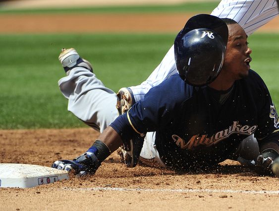 Segura dives safely back first base on a pick off attempt by Chicago Cubs starting pitcher Jon Lester during the third inning of a baseball game Thursday Aug. 13 2015 in Chicago