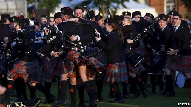 Members of the Shotts and Dykehead Pipe Band react to winning the annual World Pipe Band Championships