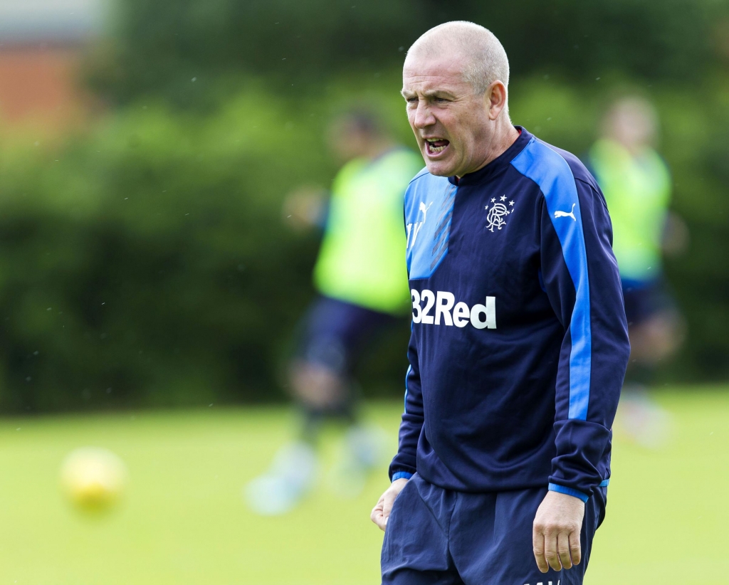 Someone to watch over themMark Warburton maintains a beady eye on his players at training ahead of tomorrow’s powderkeg clash against Hibs at Ibrox