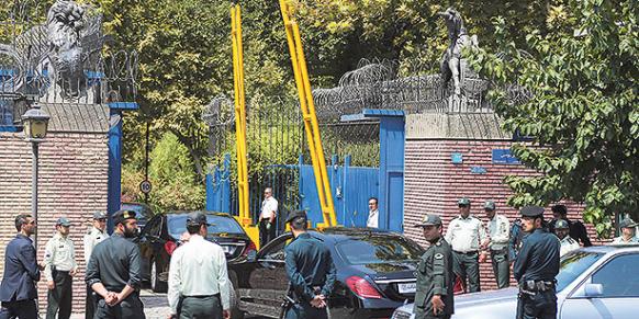 A car from British Foreign Secretary Philip Hammond's delegation arrives at the UK embassy in Tehran Iran