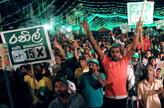 Supporters of Sri Lanka's Prime Minister Ranil Wickremesinghe attend a rally in Colombo