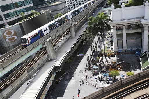 The Erawan Shrine right and Rajprasong intersection remains closed in Bangkok Thailand Tuesday Aug. 18 2015 as investigations continue the morning after an explosion. Thailand's prime minister on Tuesday promised that authorities would quickly trac