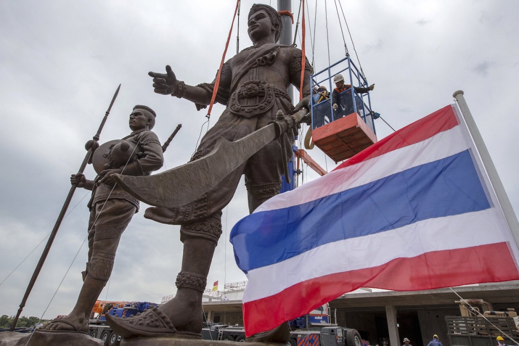 Labourers work on a giant bronze statues of former King Ram Khamhaeng and King Naresuan at Ratchapakdi Park in Hua Hin Thailand. A Thai was jailed for 30 years for ‘insulting’ the monarchy on Facebook under the junta-ruled kingdom's