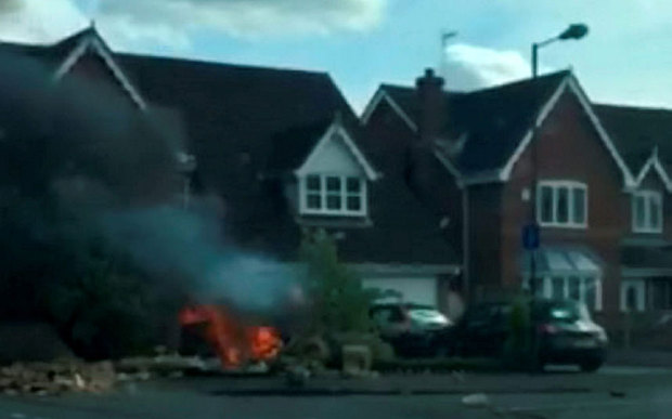 The scene where a car has crashed into a house in Branton