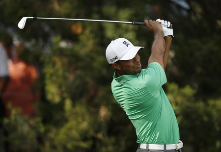 Tiger Woods of the U.S. tees off on the 12th hole during the second round of the 2013 PGA Championship golf tournament at Oak Hill Country C