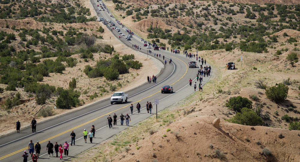 On Good Friday pilgrims travel the road from Namb