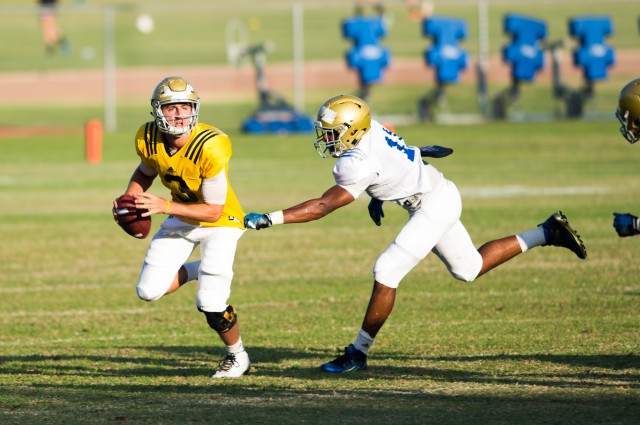 True freshman Josh Rosen keeps his eyes down-field as he escapes the pocket during UCLA's fall scrimmage. Rosen was named Wednesday as UCLA football's starting quarterback for the Bruins&#039 season opener Sept. 5 against Virginia. (Max Himmelr