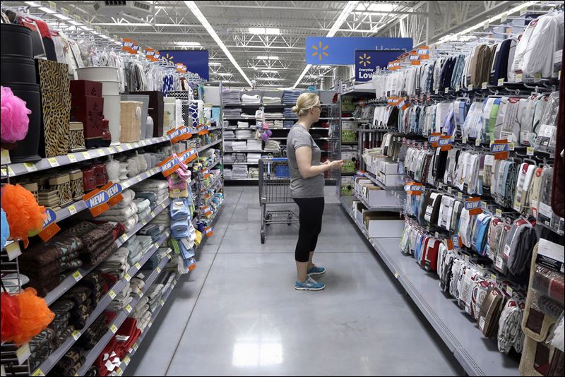 A customer shops for home accessories at a Wal Mart Supercenter store in Springdale Ark