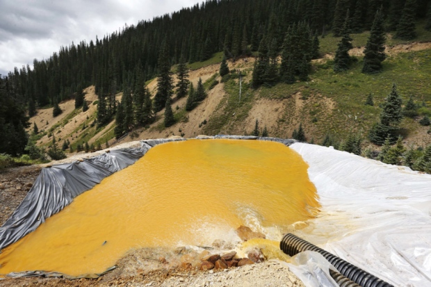 Water flows through a retention pond outside Silverton built to contain and filter out heavy metals and chemicals from the Gold King mine wastewater accident