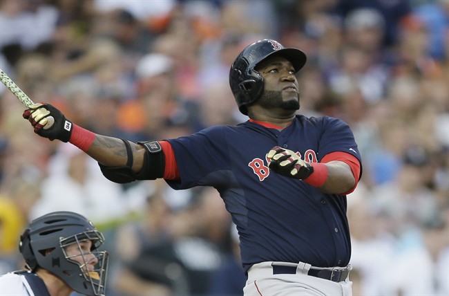 Boston Red Sox designated hitter David Ortiz follows through on his two-run home run off Detroit Tigers starting pitcher Daniel Norris during the third inning of a baseball game Friday Aug. 7 2015 in Detroit