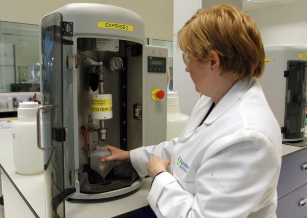 Scientists Jeanette Williams examines water samples