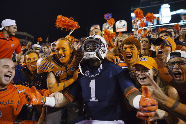 Auburn wide receiver D'haquille Williams celebrates with fans after Auburn's 41-7 win over LSU in an NCAA college football game Saturday Oct. 4 2014 in Auburn Ala