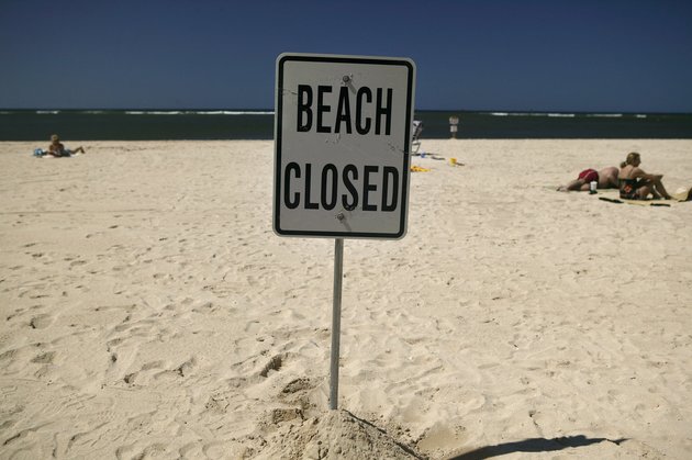 Most of the famed beach fronting Waikiki was closed on Monday after heavy rains triggered a half-million gallon sewage spill