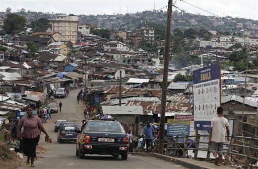 13 2015 a billboard advises people how to keep free of Ebola in a shanty town on the outskirts of Freetown Sierra Leone as people in the nearby village of Massessehbeh are finally released from Ebola quarantine aft