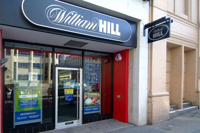 William Hill profit down; buys 29.4% of online lottery software firm NeoGames