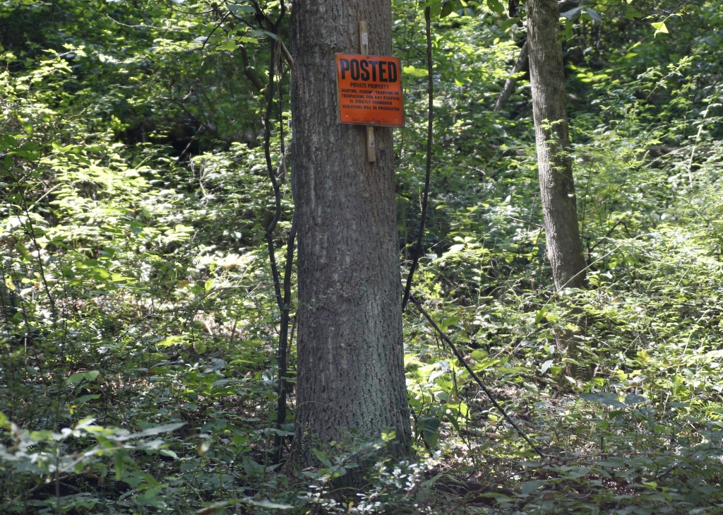 Zimbabwe Lion Killing No trespassing signs are posted on trees around the property near the home of Dr. Jan Casimir Seski in Murrysville Pa. on Sunday Aug. 2 2015. Zimbabwe's National Parks and Wildlife Management Authority accused Seski of illeg