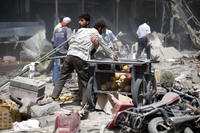 Air raids near Syrian capital kill more than 50