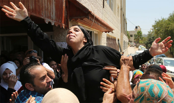 Slain Palestinian toddler's parents brother fighting for lives