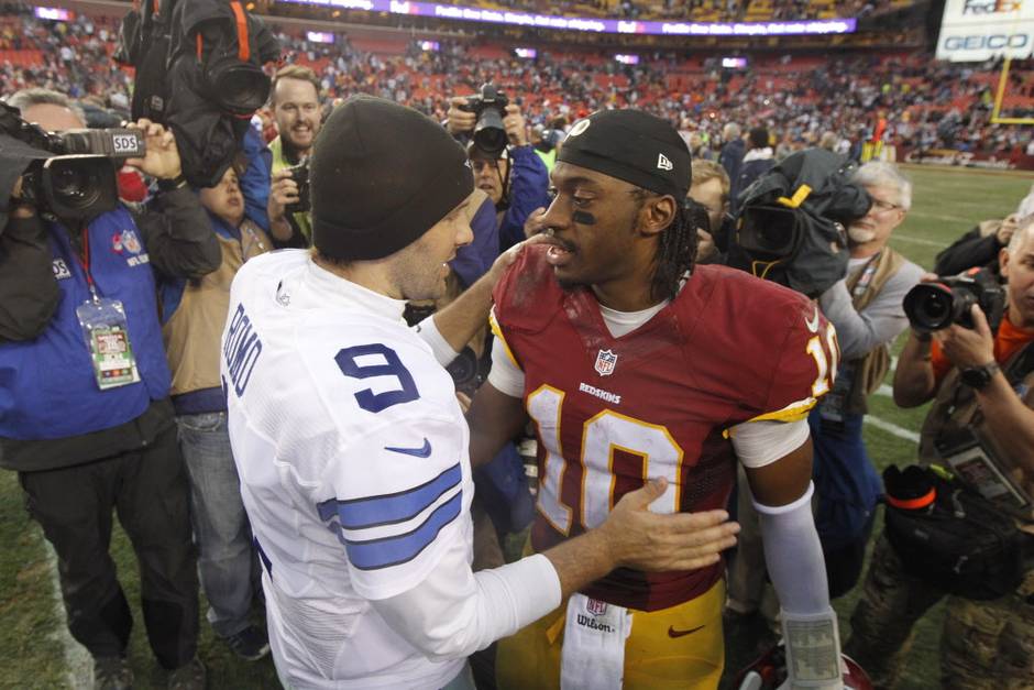 Dallas Cowboys quarterback Tony Romo greets Washington Redskins quarterback Robert Griffin III after their NFL football game at Fed Ex Field in Landover MD on Dec 28 2014