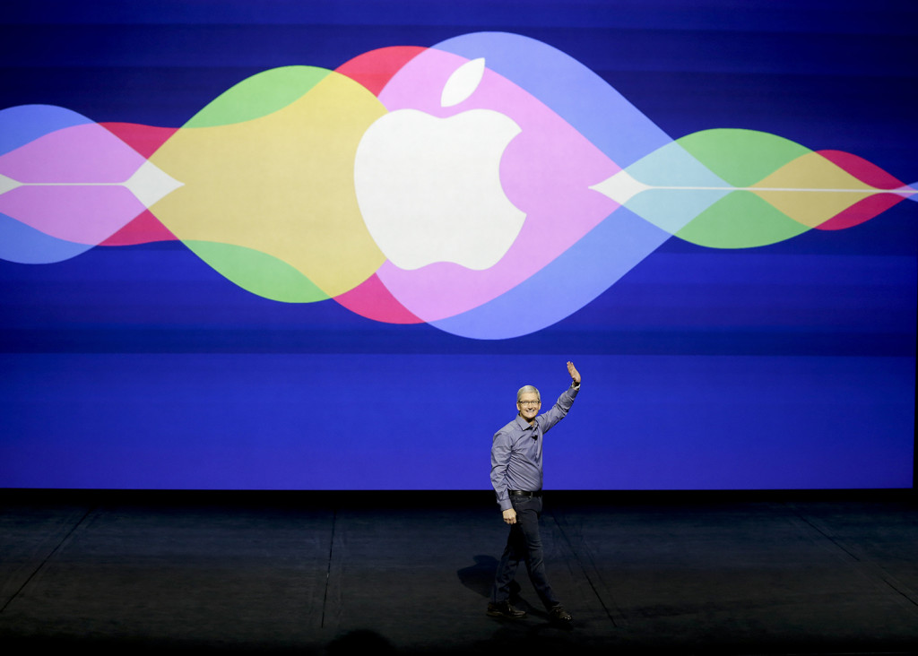 Apple CEO Tim Cook opens the Apple event at the Bill Graham Civic Auditorium in San Francisco Wednesday. The Associated Press