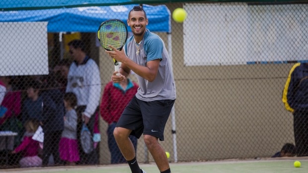 Australian tennis star Nick Kyrgios preparing to hit a shot at the Weston Creek Tennis Club's Tennis Carnivale on Saturday