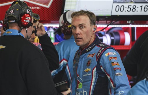 Driver Kevin Harvick waits in the garage while his car is worked on during practice for Sunday's NASCAR Sprint Cup series auto race at New Hampshire Motor Speedway in Loudon N.H. Friday Sept. 25 2015