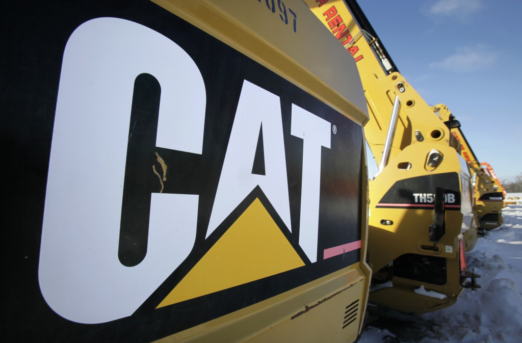 Caterpillar to cut jobs; trims revenue outlook