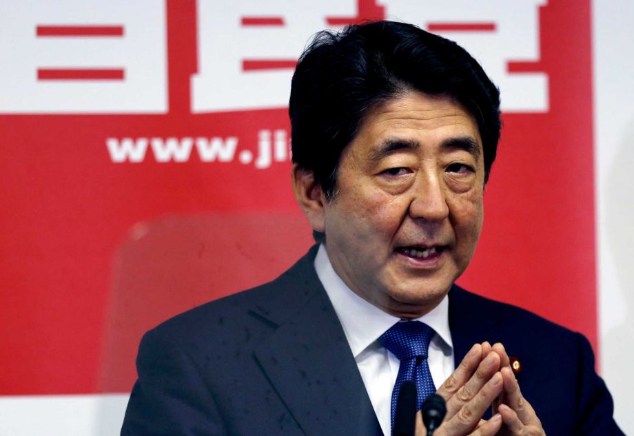 Japanese Prime Minister Shinzo Abe delivers a speech during a press conference at the headquarters of his ruling Liberal Democratic Party in Tokyo Thursday Sept. 24 2015. Prime Minister Abe fresh from a bruising battle over unpopular military legisla