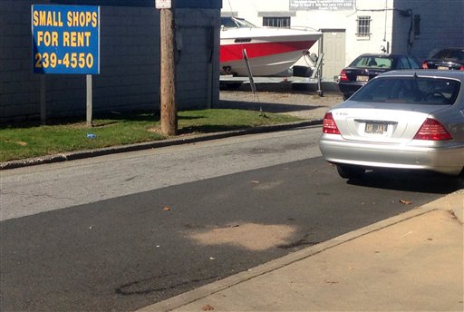 The scene of where Delaware police officers fatally shot an armed man Wednesday Sept. 23 2015 in wheelchair after responding to a call that he had a self-inflicted gunshot wound is seen Thursday Sept. 24 2015 in Wilmington Del. Authorities say a