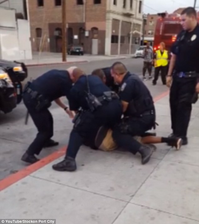 End of the ordeal The officers are caught on camera forcing the suspect to the ground and cuffing him