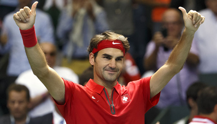 Roger Federer of Switzerland celebrates on the court after beating Thiemo De Bakker of The Netherlands giving Switzerland a 3-1 lead after the third match of the Davis Cup World Group Play-off round match between Switzerland and Netherlands in Genev