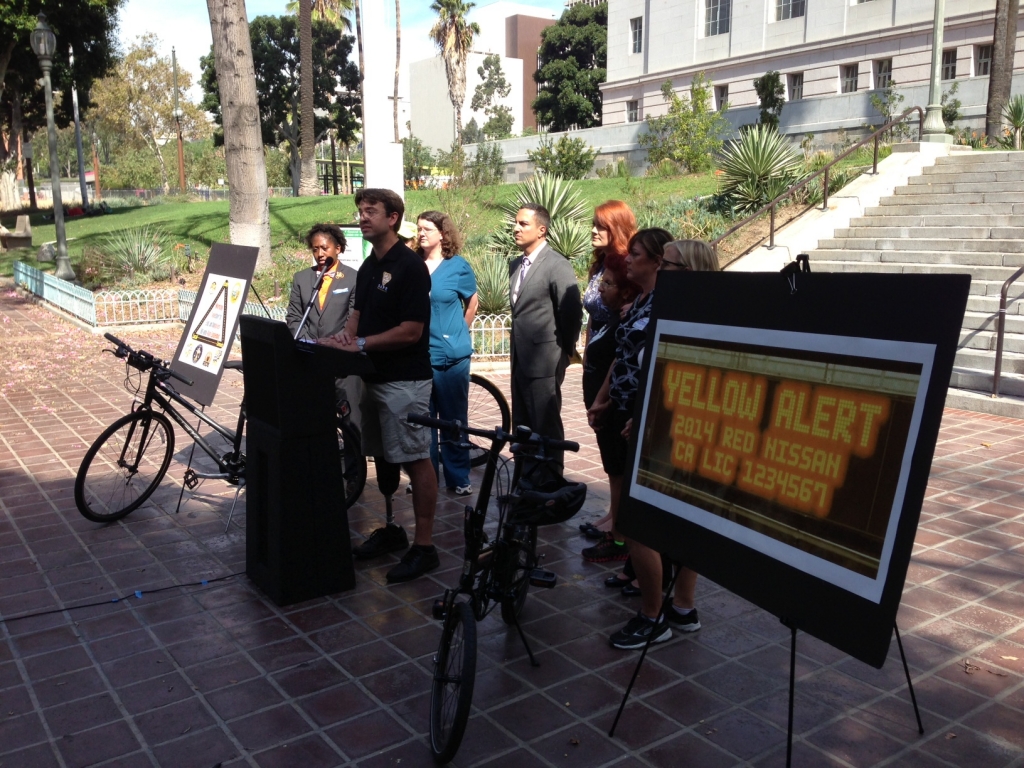 Hit-and-run victim Damian Kevitt addresses this morning's A.B. rally at Los Angeles City Hall