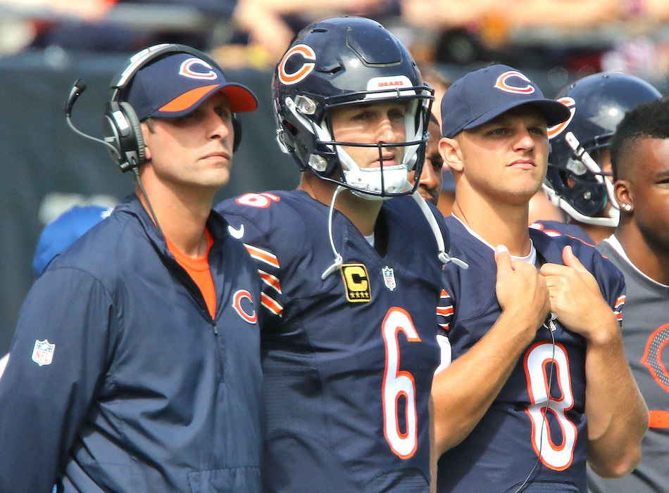 Bears offensive coordinator Adam Gace and quarterbacks Jay Cutler and Jimmy Clausen watch the action from the sideline in the first half on Sunday