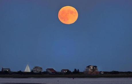 A supermoon rose over Long Beach in Plymouth Bay on Sunday as seen from the Nelson Street Playground