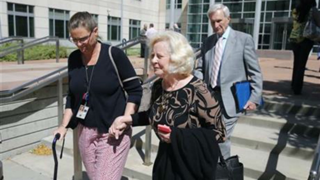 Yvonne and Bob Bertolet center and right the parents of Toni Henthorn walk with a family friend from a federal courthouse in Denver Friday Sept. 18 2015 following closing arguments in the murder trial