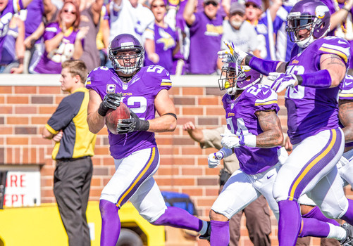 Chad Greenway steps into the end zone after running an interception back 91 yards